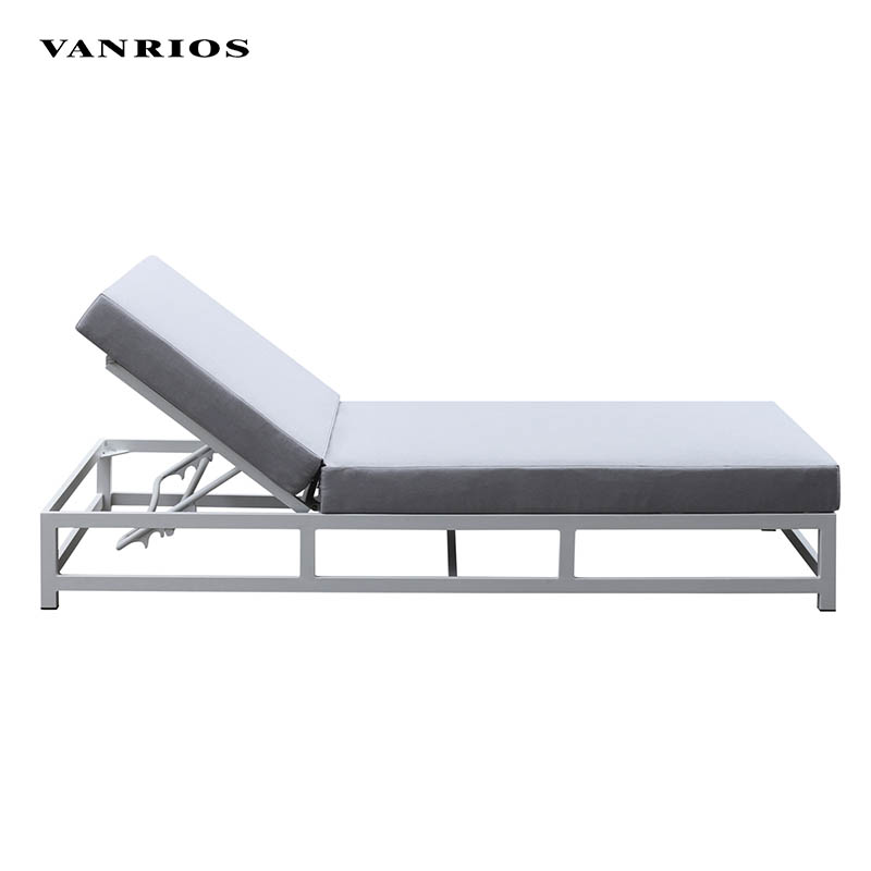 Luxury outdoor aluminum daybed beside a modern resort swimming pool